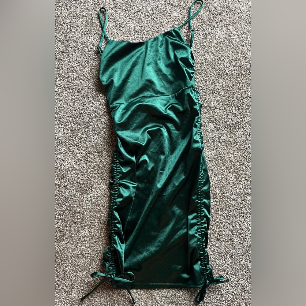 Small forest green form fitting dress. Perfect for a holiday party or dance.